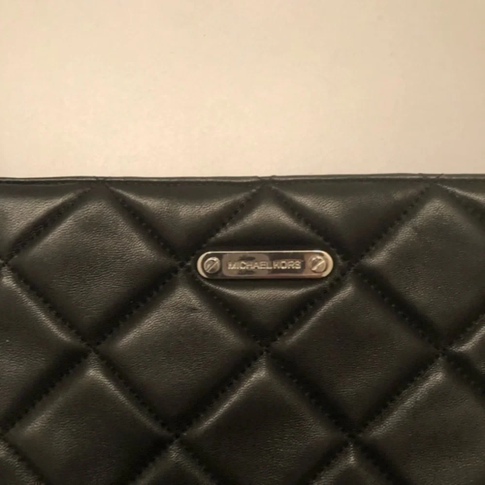 Michael kors black leather quilted mini bag